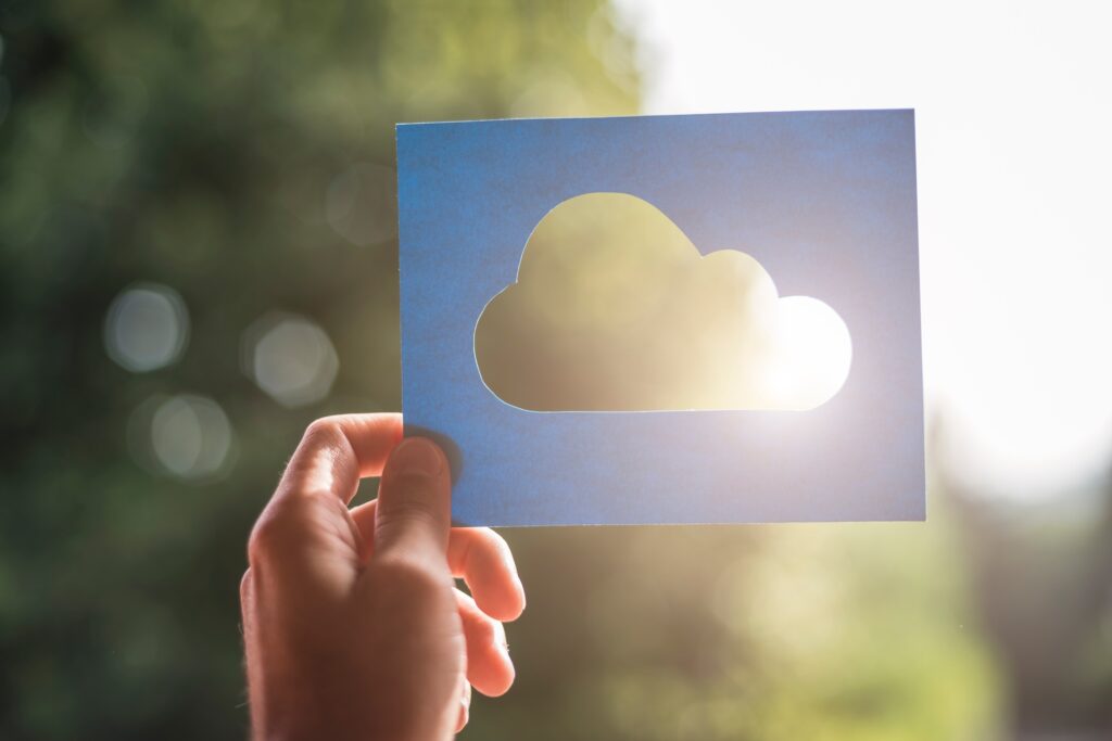 Hand holding cloud computing symbol